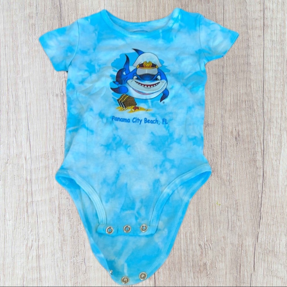 Art on T’s shirt sleeve onesie